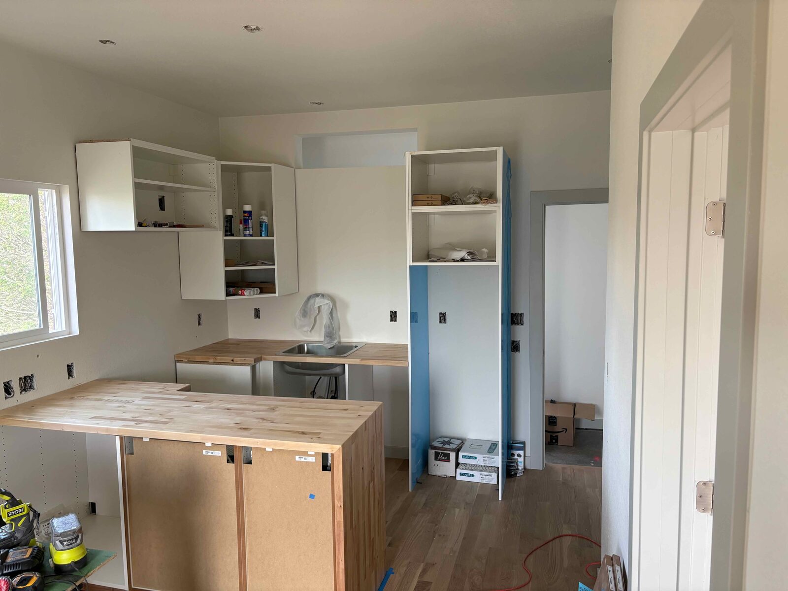 Kitchen cabinetry going in.