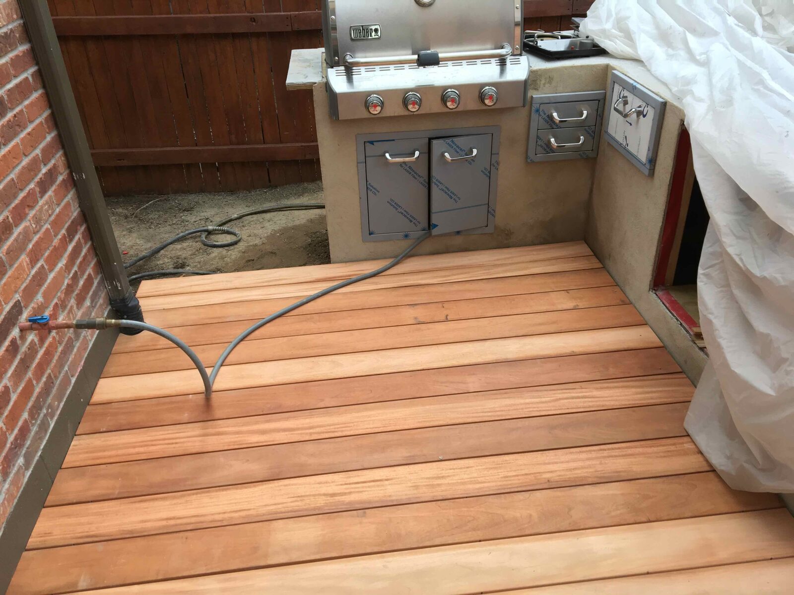 Hardwood decking laid over the new frame.