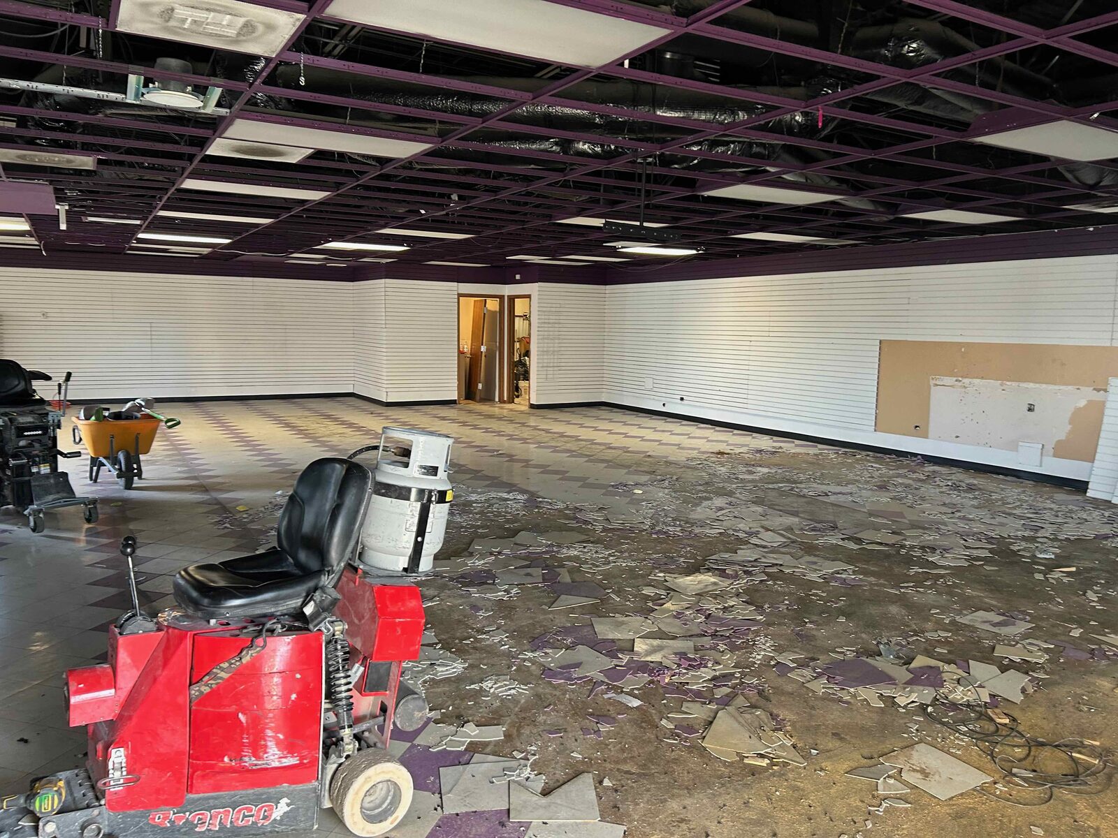 Grinding the slab down to bare concrete.
