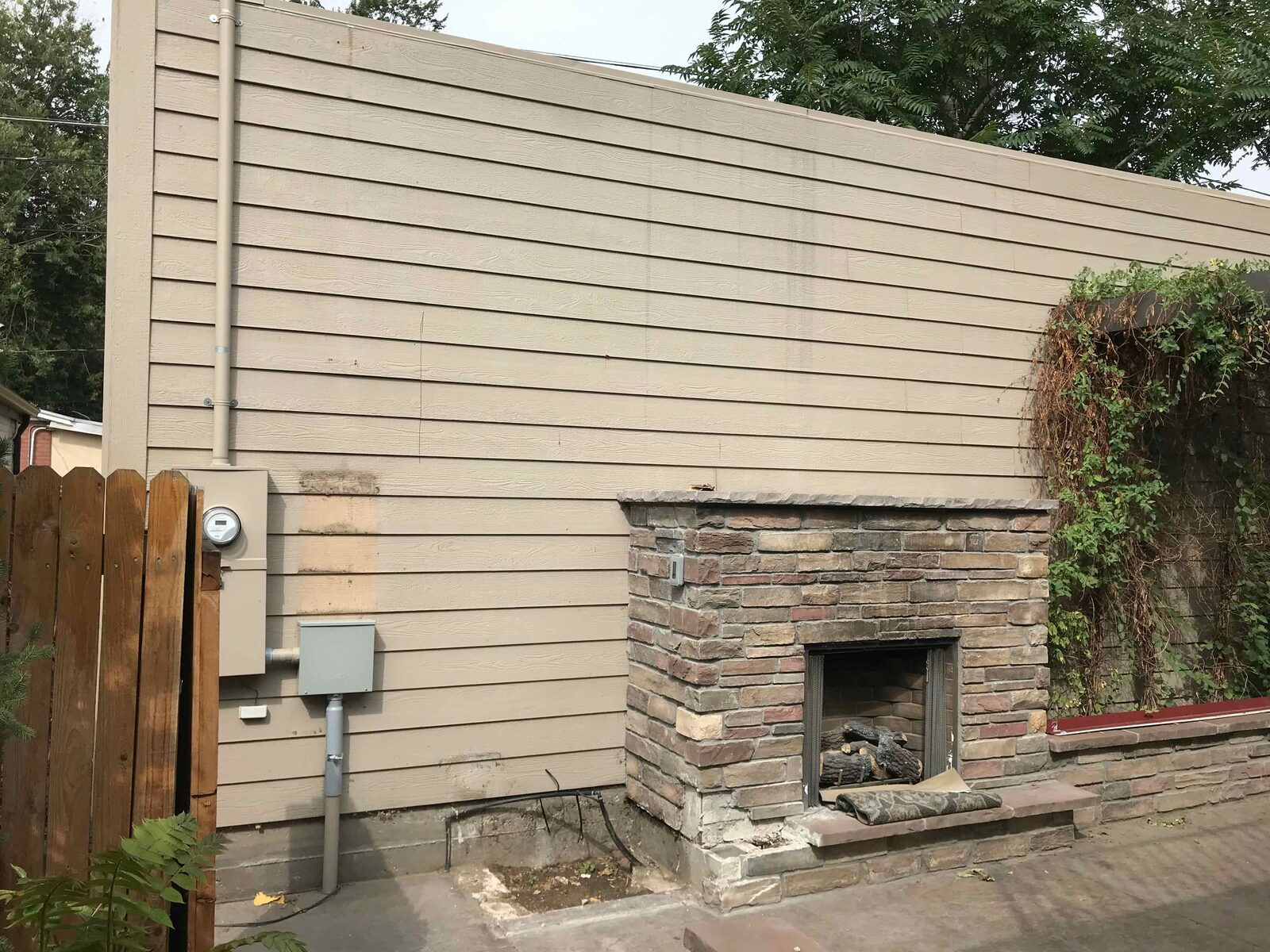 The finished exterior fireplace and courtyard.