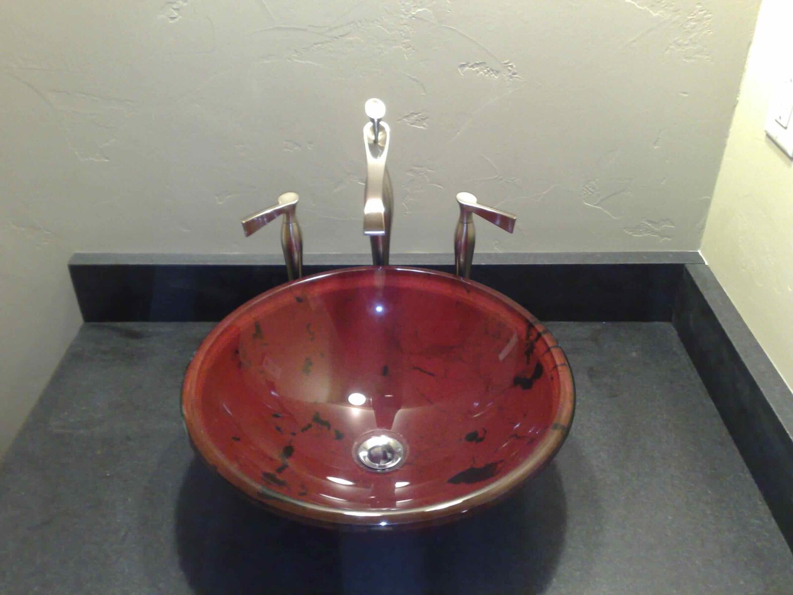 A custom art-glass vessel sink.
