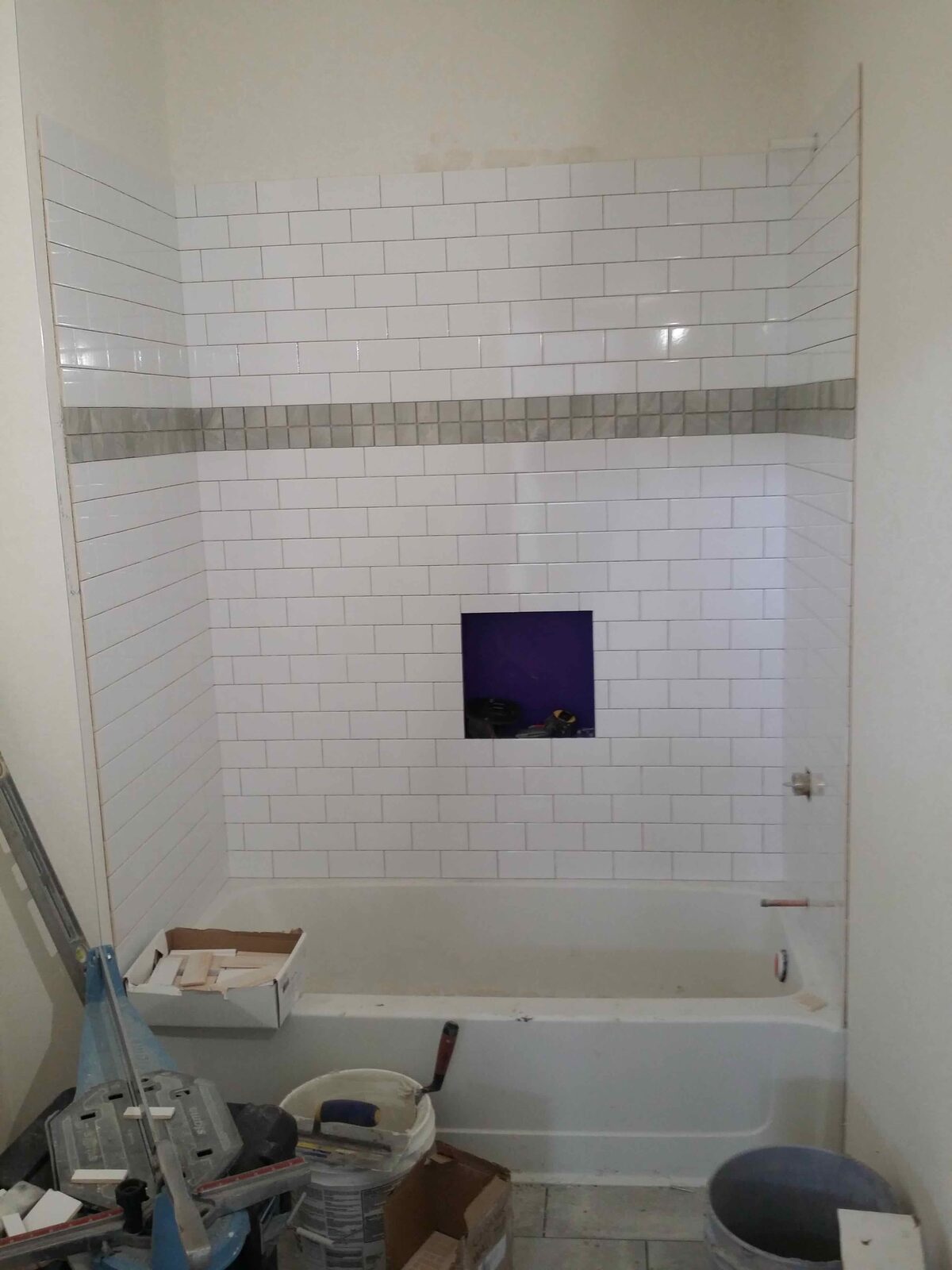Subway-tiled tub surround.